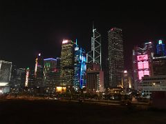 12B AIA Central, CCB Tower, Bank Of China Tower, Cheung Kong Centre, HSBC Building lit up at night from near Star Ferry Central pier Hong Kong